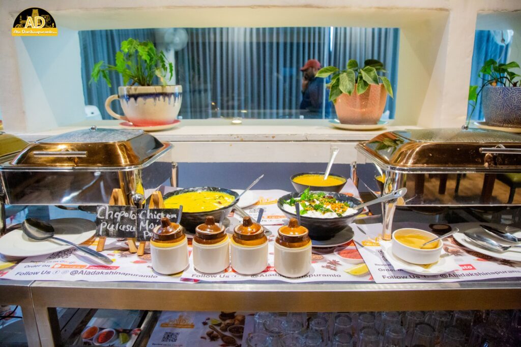 Ala Dakshinapuramlo - Various curries, chutneys, and pickles served in bowls and laid out on the table