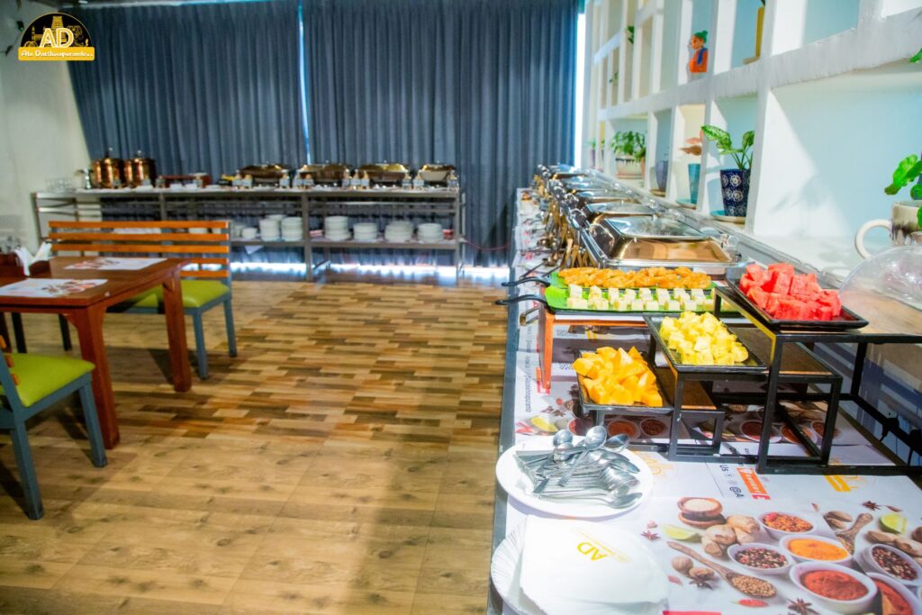 Ala Dakshinapuramlo - A variety of cut fruits and sweets displayed on the table